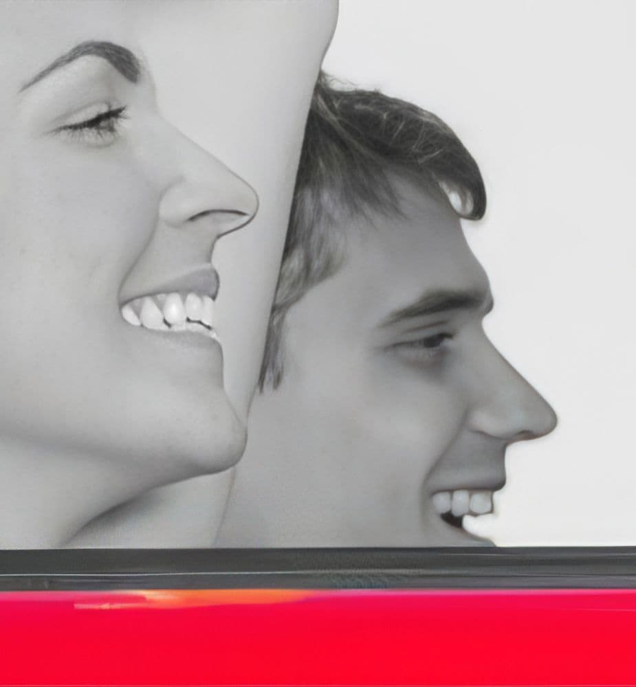 Woman and Man driving car and smiling