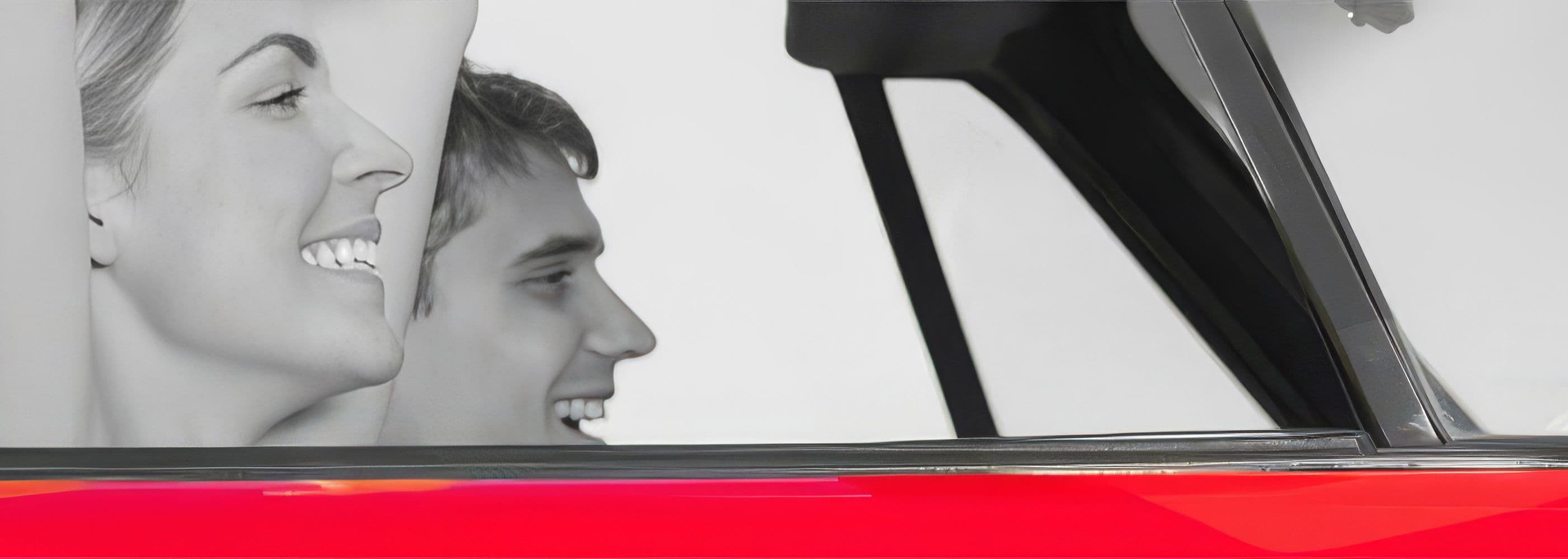 Woman and Man driving car and smiling